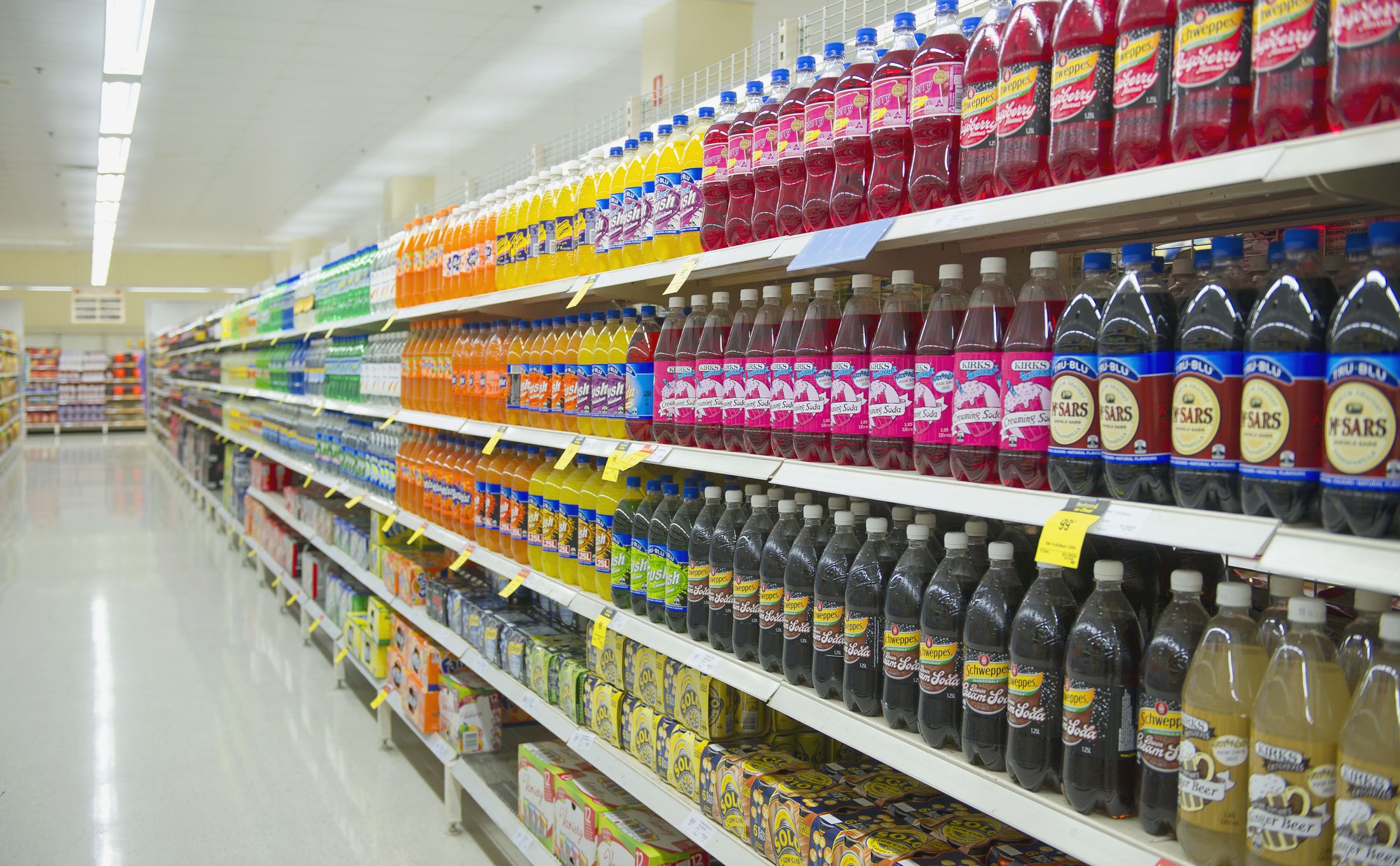 Bottled juice on supermarket shelves