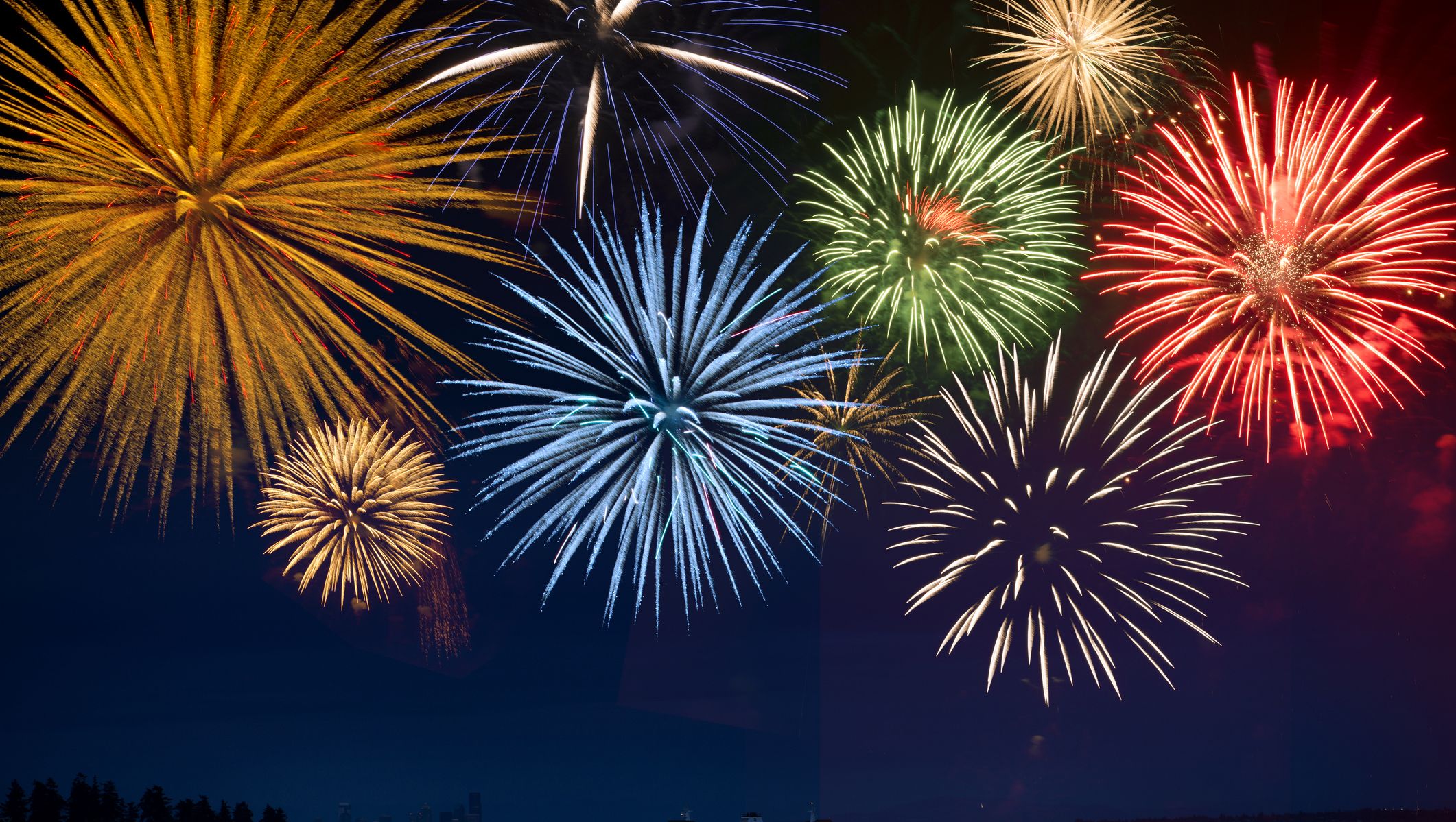 Fireworks exploding over cruise ship in bay, Seattle, Washington, United States