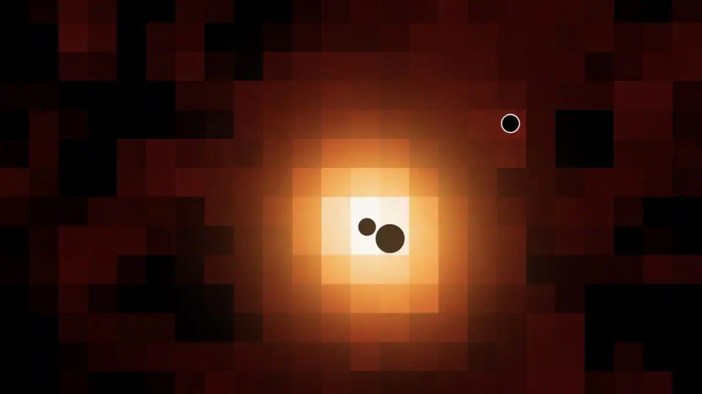 Por primera vez encuentran tres agujeros negros supermasivos en una sola galaxia 2 Mapa de la galaxia lejana J0148-4214 en hidrógeno ionizado (Hα). Las ubicaciones de los tres agujeros negros masivos se indican con círculos negros (sin escala). Los agujeros negros más masivo y menos masivo se encuentran en el centro de la galaxia; un tercer agujero negro se encuentra en las afueras de la galaxia. Crédito: Hannah Übler